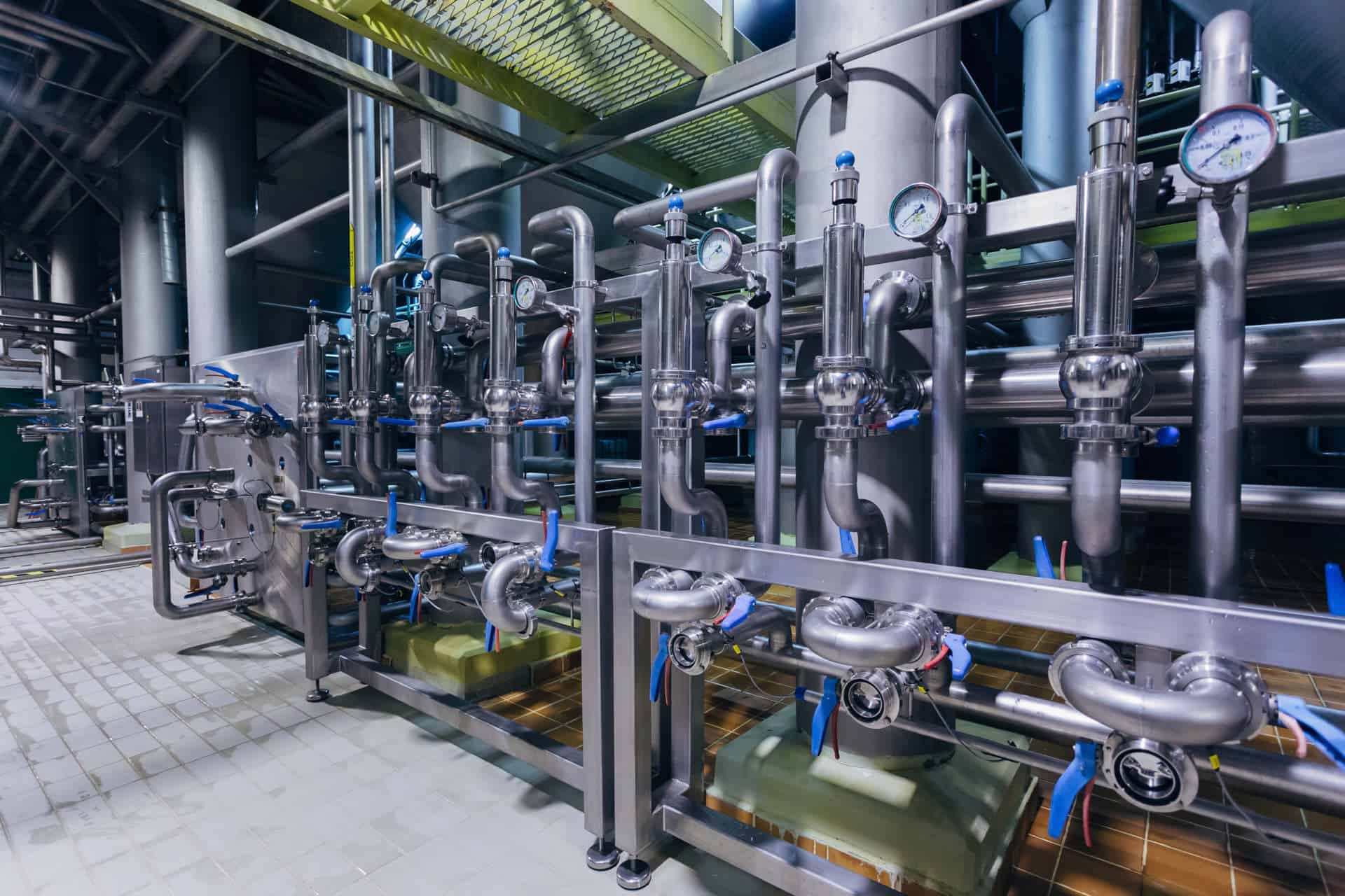 A photo showing an industrial water system inside of a commercial building